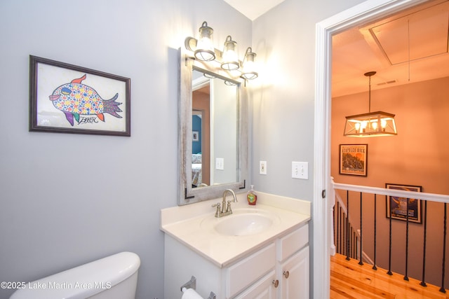 128 River Ridge Rd Unit B3, Alexander City, AL 35010 - bathroom with toilet, vanity, and wood finished floors