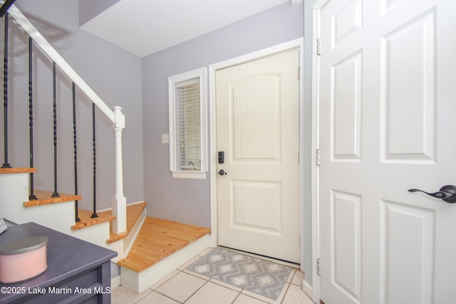 128 River Ridge Rd Unit B3, Alexander City, AL 35010 - entrance foyer featuring light tile patterned flooring and stairway