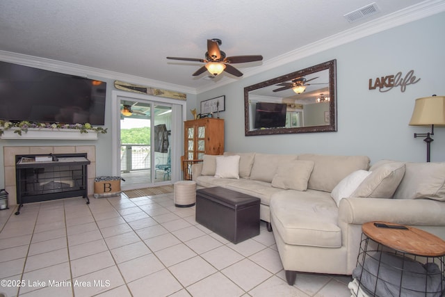 128 River Ridge Rd Unit B3, Alexander City, AL 35010 - living area featuring crown molding, ceiling fan, light tile patterned floors, and a fireplace
