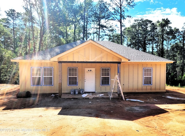 198 Mccain Rd, Eclectic, AL 36024 - view of front of home featuring roof with shingles, board and batten siding, and covered porch