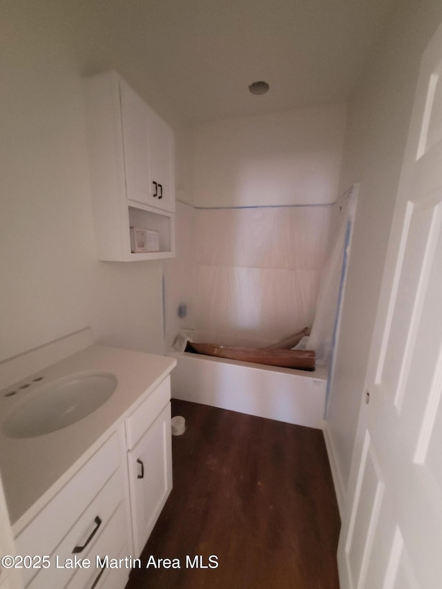 198 Mccain Rd, Eclectic, AL 36024 - full bathroom with vanity, a tub to relax in, wood finished floors, and a shower
