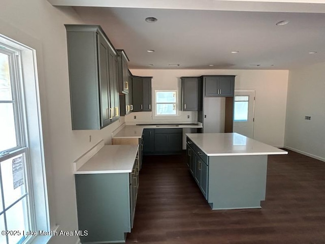 198 Mccain Rd, Eclectic, AL 36024 - kitchen featuring gray cabinets, a center island, dark wood-style floors, recessed lighting, and light countertops