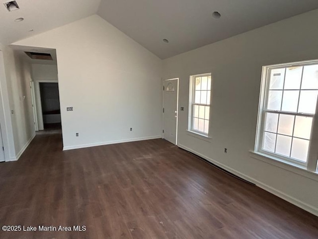 198 Mccain Rd, Eclectic, AL 36024 - empty room with lofted ceiling and dark wood-type flooring