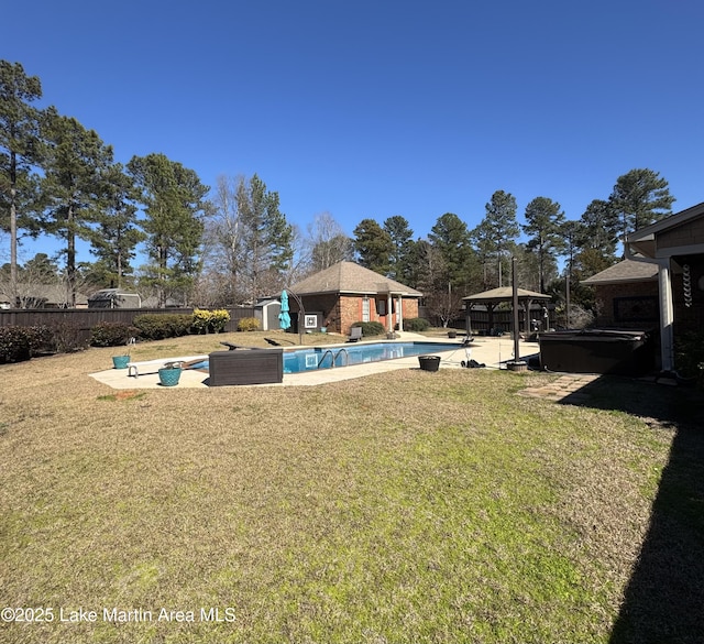 view of yard featuring a gazebo, a patio, a fenced backyard, and a fenced in pool