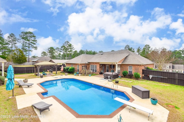 view of swimming pool with a gazebo, a patio area, a yard, and a hot tub