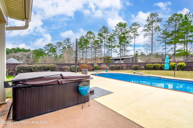 view of swimming pool with a patio, a fenced backyard, a fenced in pool, and a hot tub