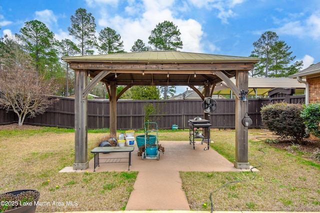 view of patio with a gazebo, area for grilling, and a fenced backyard