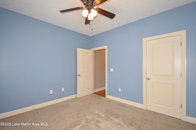 unfurnished bedroom with carpet, baseboards, and ceiling fan