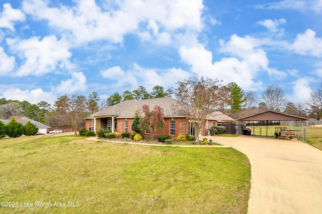 view of front of property featuring brick siding, concrete driveway, a front lawn, and fence