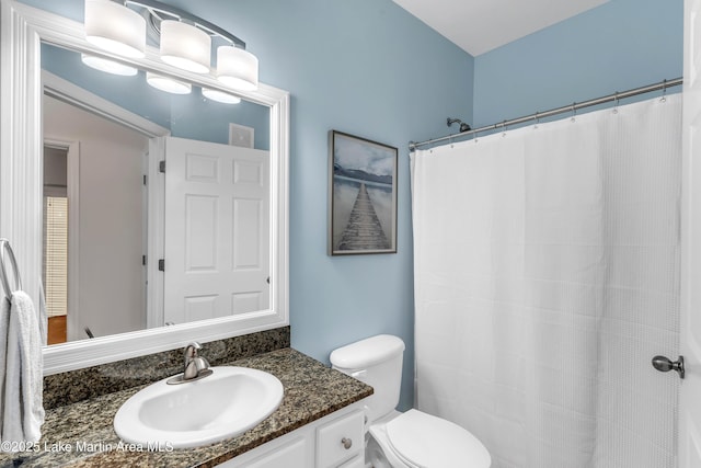 230 Crowne Pointe Rd Unit 104, Dadeville, AL 36853 - full bathroom featuring vanity, toilet, and a shower with curtain