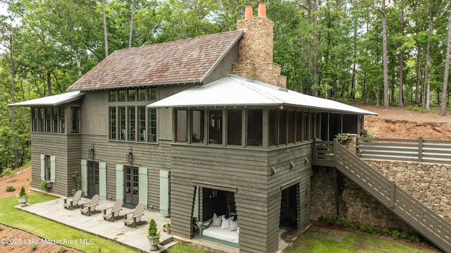 back of property featuring a patio area