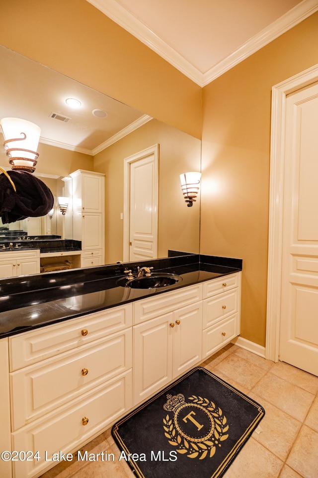 bathroom with tile patterned flooring, vanity, and ornamental molding