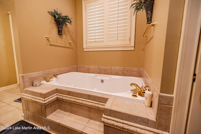 bathroom featuring tile patterned floors and a washtub