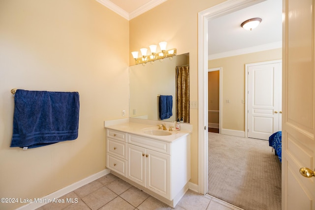 bathroom featuring tile patterned floors, vanity, and ornamental molding