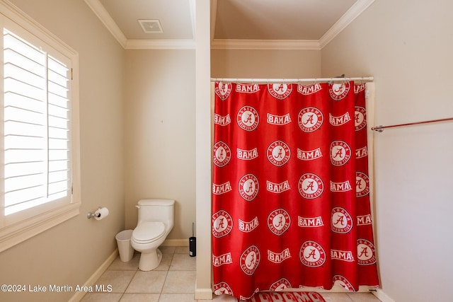 bathroom featuring toilet, tile patterned flooring, and ornamental molding