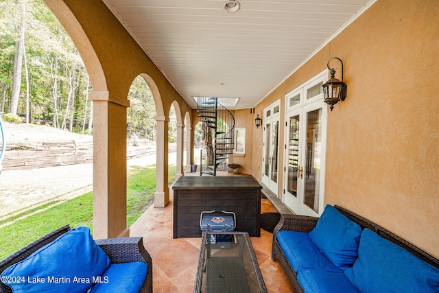 view of patio featuring an outdoor living space and french doors