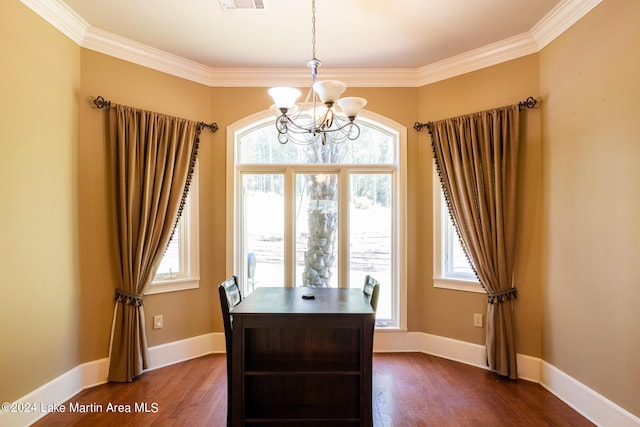 home office featuring dark hardwood / wood-style flooring, a wealth of natural light, and ornamental molding