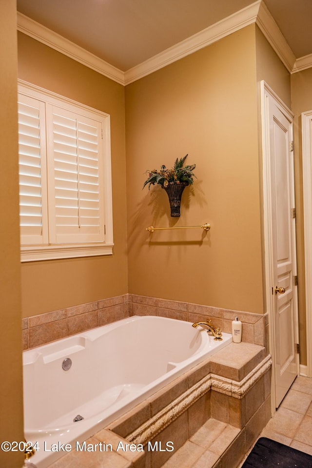 bathroom featuring tile patterned floors, a relaxing tiled tub, and ornamental molding