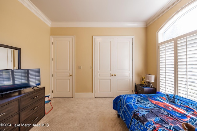 bedroom with light colored carpet, a closet, and crown molding