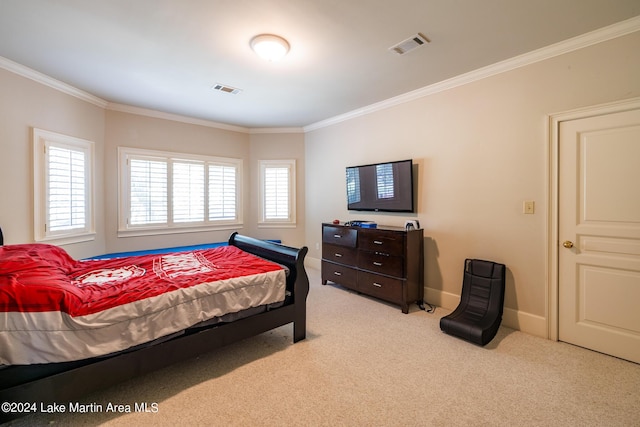 carpeted bedroom featuring crown molding