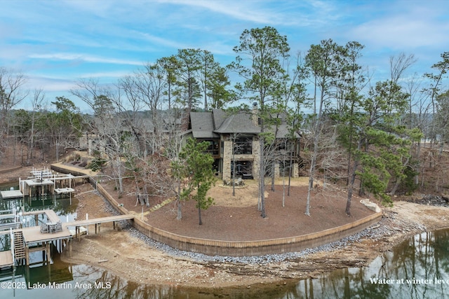 rear view of property with a water view