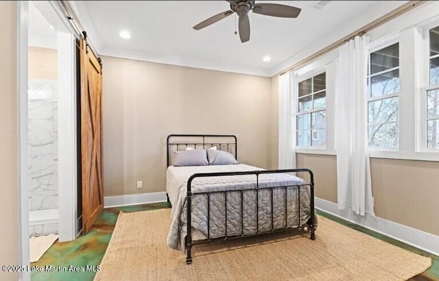 bedroom featuring crown molding, a barn door, and ceiling fan