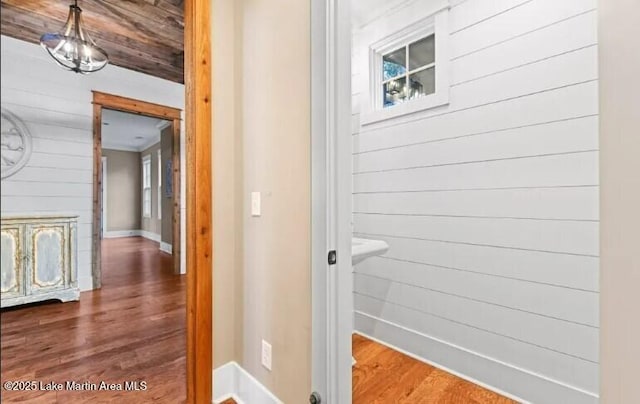 bathroom featuring hardwood / wood-style flooring and wood walls