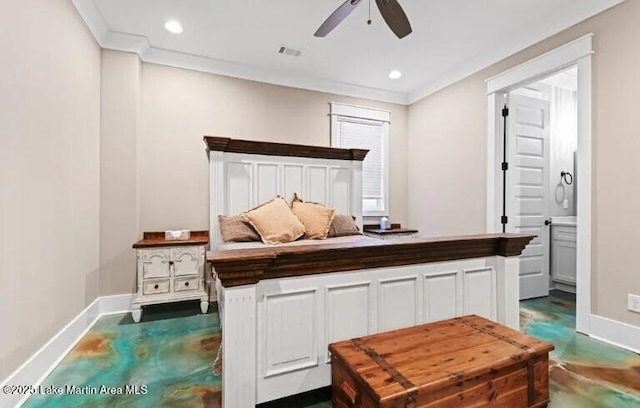 bedroom featuring crown molding, ceiling fan, and ensuite bathroom