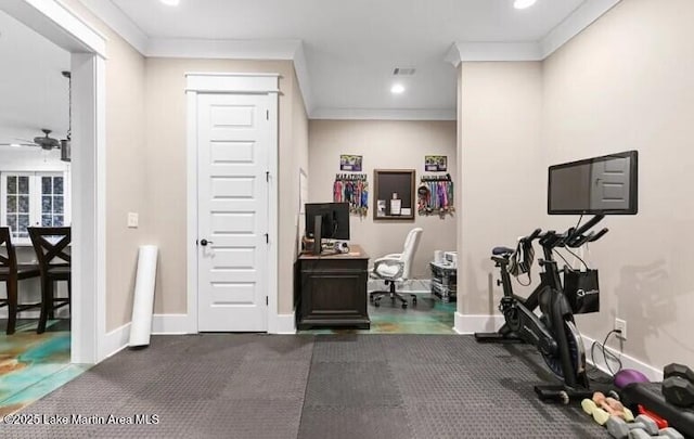 exercise room featuring ornamental molding and ceiling fan