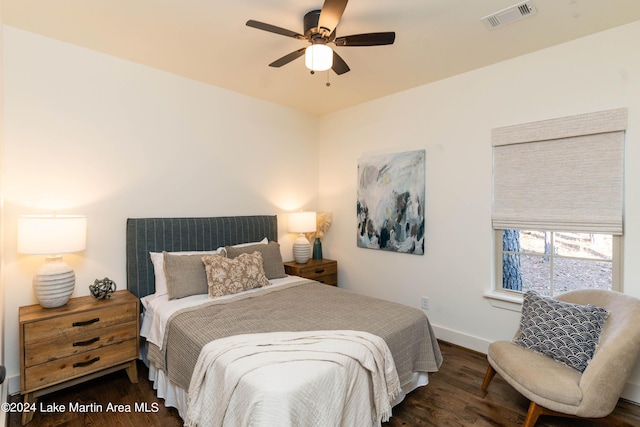 bedroom with ceiling fan and dark wood-type flooring