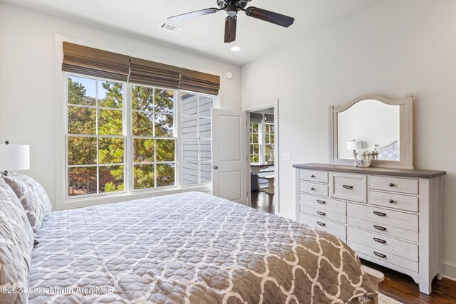 bedroom with ceiling fan and dark hardwood / wood-style floors