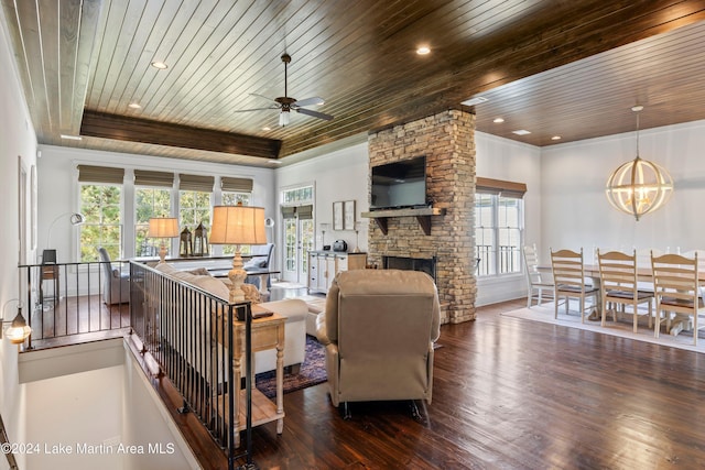 living room with a healthy amount of sunlight and wooden ceiling