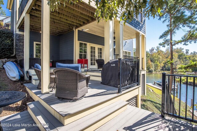 wooden terrace with a water view