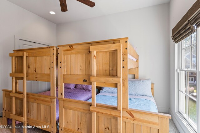 carpeted bedroom with ceiling fan