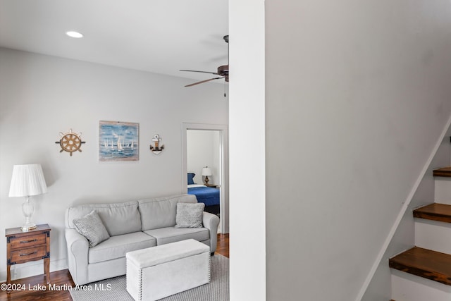 living room with ceiling fan and hardwood / wood-style flooring