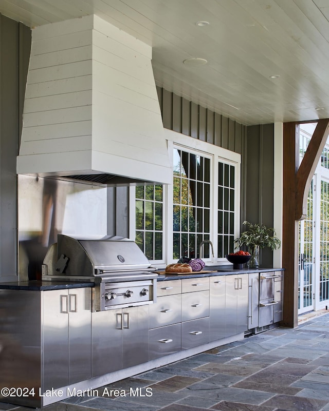 view of patio / terrace with an outdoor kitchen and a grill