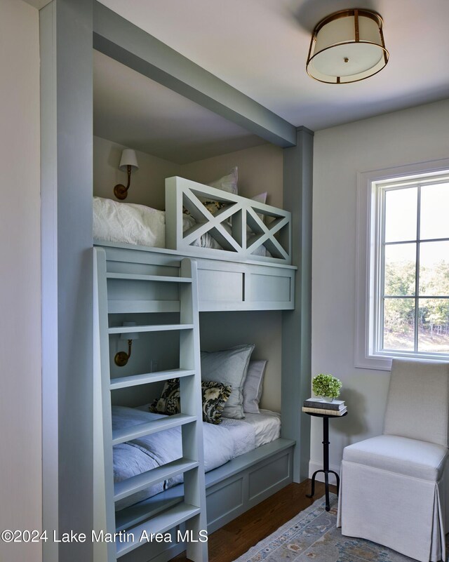 spacious closet with dark hardwood / wood-style floors