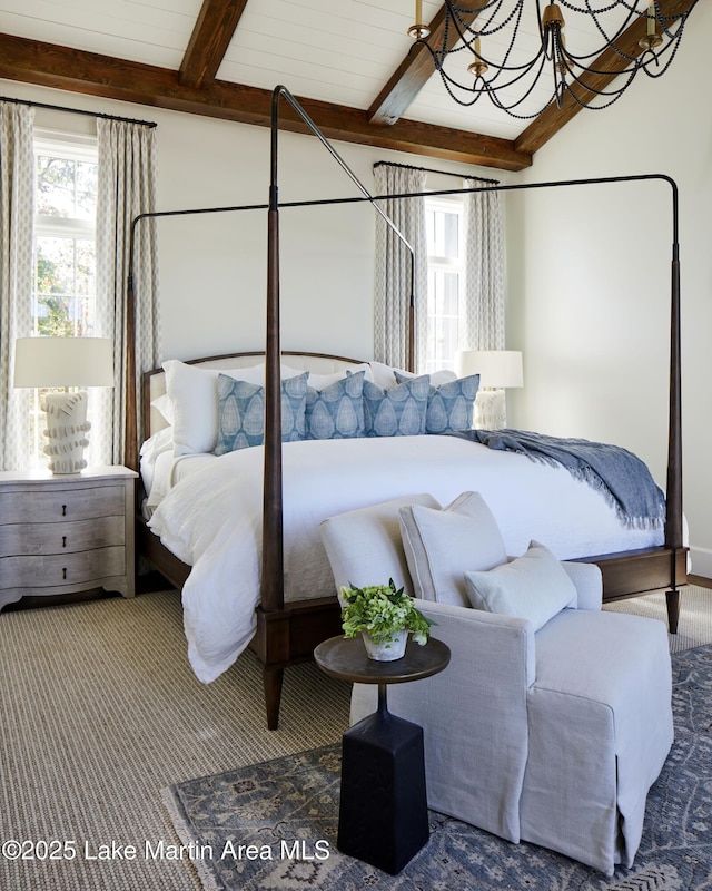 bedroom featuring beam ceiling and a notable chandelier