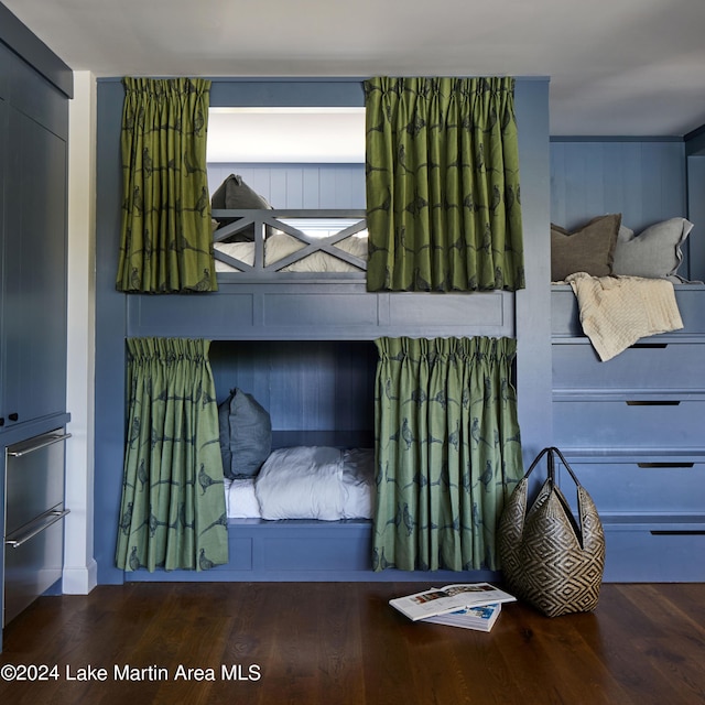 bedroom with wood-type flooring