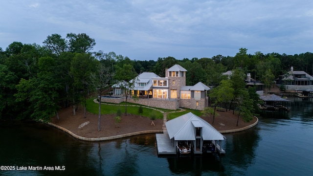 view of dock with boat lift and a water view