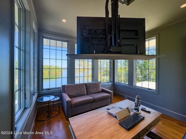 living room with hardwood / wood-style flooring and crown molding