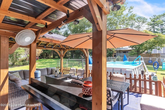 207 Mcdonald St, Dadeville, AL 36853 - fenced backyard with outdoor lounge area, a patio, and outdoor dining space