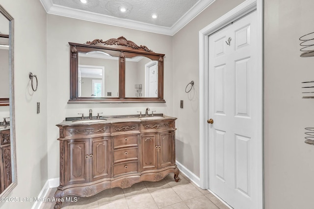 207 Mcdonald St, Dadeville, AL 36853 - full bathroom featuring double vanity, crown molding, tile patterned floors, a textured ceiling, and recessed lighting