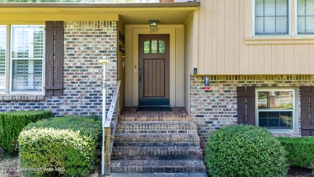 207 Mcdonald St, Dadeville, AL 36853 - doorway to property featuring brick siding