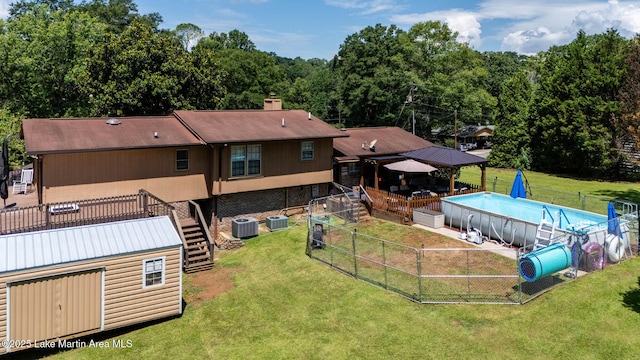 207 Mcdonald St, Dadeville, AL 36853 - rear view of house with stairs, a gazebo, and a chimney