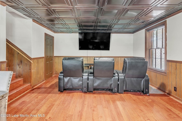 207 Mcdonald St, Dadeville, AL 36853 - cinema room with a wainscoted wall, wooden walls, light wood-style floors, and an ornate ceiling
