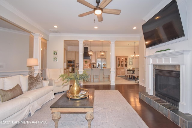1520 Club Creek Dr, Auburn, AL 36830 - living room with dark wood-style flooring, ornamental molding, ceiling fan with notable chandelier, and recessed lighting