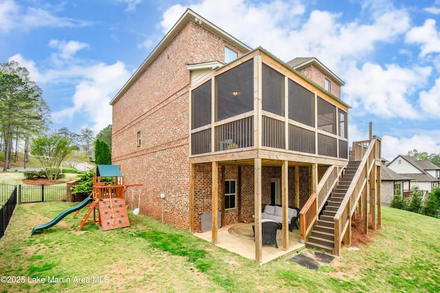 1520 Club Creek Dr, Auburn, AL 36830 - back of property with a sunroom, stairs, brick siding, a yard, and a patio area