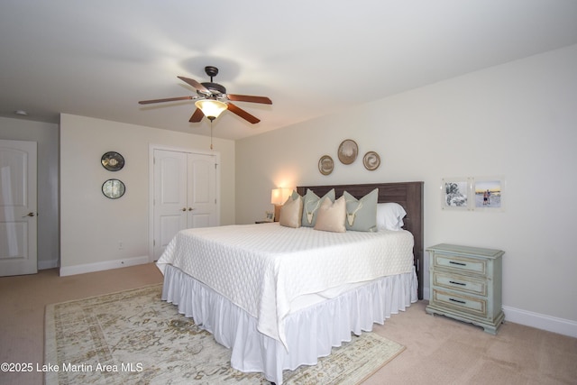 1520 Club Creek Dr, Auburn, AL 36830 - bedroom with a closet, ceiling fan, baseboards, and light carpet