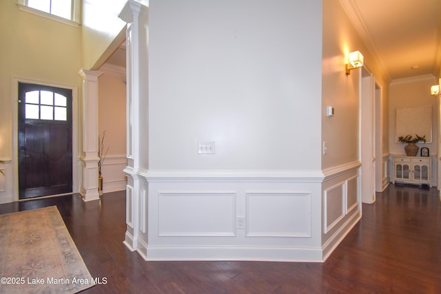 1520 Club Creek Dr, Auburn, AL 36830 - entryway with ornate columns, dark wood-style flooring, ornamental molding, a decorative wall, and wainscoting